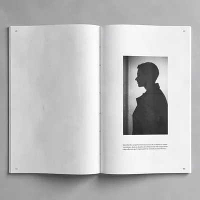 Editorial composition of two facing pages with a vertical-video silhouette and s