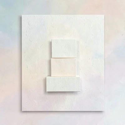 Card with three stacked cream blocks suggesting savings tiers, paper grain visib