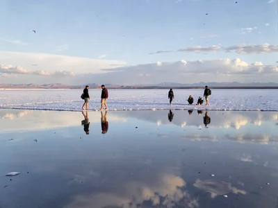 Multiple figures and reflections creating pattern