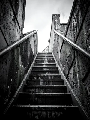 Staircase entering from bottom left corner ascending out of top