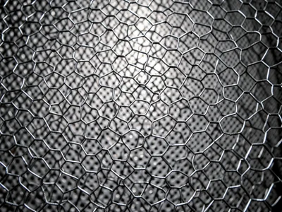 Chicken wire hexagonal pattern, thin wire creating regular hexagons, slightly de