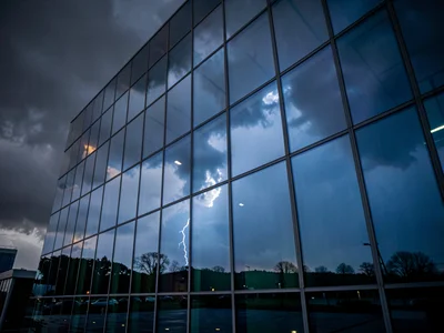 Building reflecting approaching storm dramatic