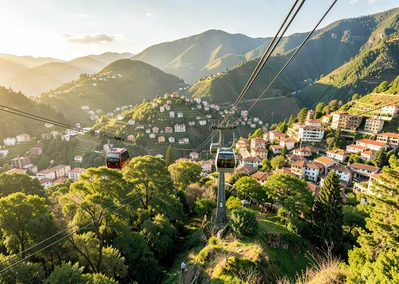 Eternal spring light over transforming Medellín, metro cable car ascending over 