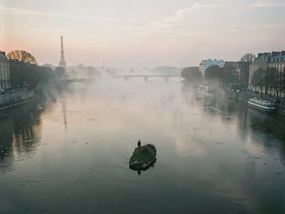 Island tip barely visible through river mist