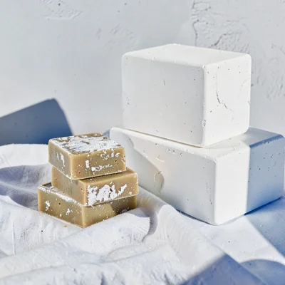 Cycladic whitewash study, Greek island lime, Olive oil soap bars stacked on whit