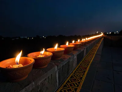 Row of Diyas Along Parapet at Dusk