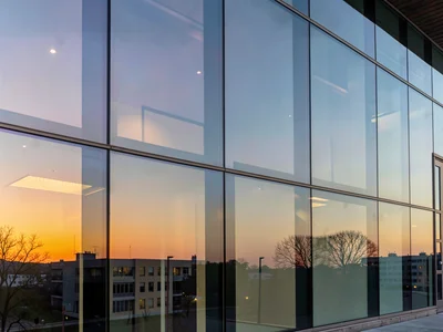 Building showing sunset reflection on one side