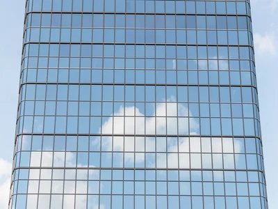 Curtain-wall office tower elevation showing nothing but a perfect grid of mirror