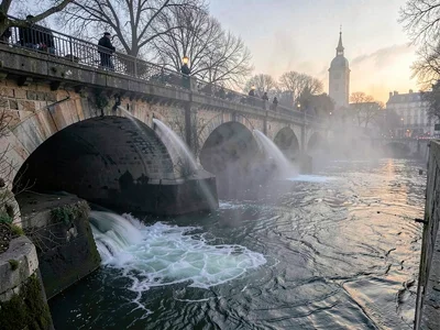 Mist streamers flowing under bridge arches
