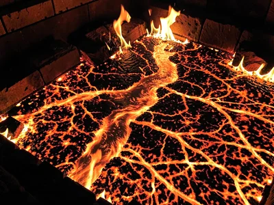 Ember bed showing river-like flow patterns