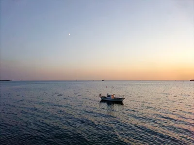 Horizon with dot of boat