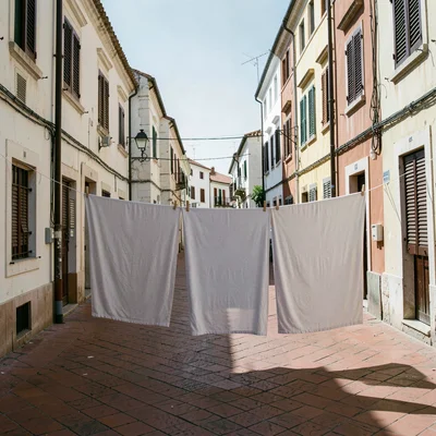 Siesta stillness, afternoon heat weight, Laundry frozen still on a line, no bree
