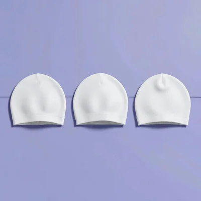Wide retargeting layout of three swim caps arranged in a row across a periwinkle