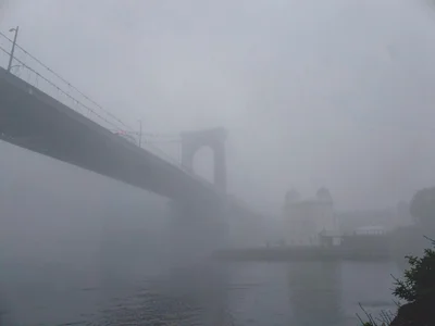 Bridge disappearing in smog