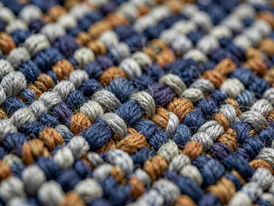 Twill of alpaca dyed lichen-grey runs diagonal ridges across the frame with char