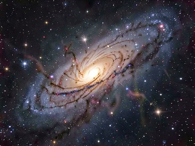 Galaxy behind nebula creating depth