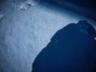 Shadow on snow blue tinted