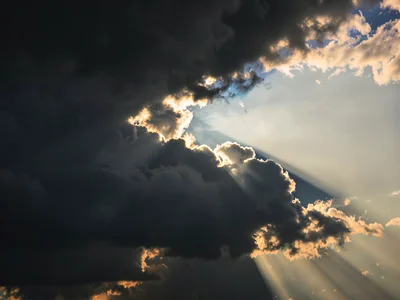 Sunset beam through storm clouds