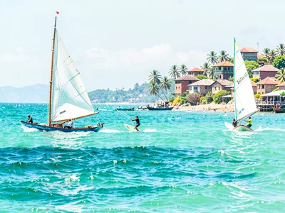 Brilliant Indian Ocean noon light in Dar es Salaam, Kite surfers on ocean, white