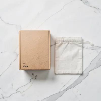 Kraft box and linen pouch duo flat-lay