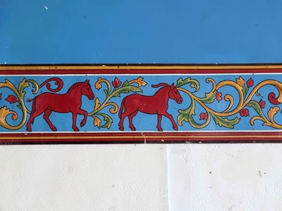 Dalarna interior wall detail — painted frieze band of kurbits folk motifs in ful