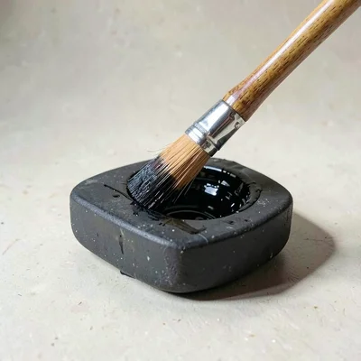 Brush in inkstone