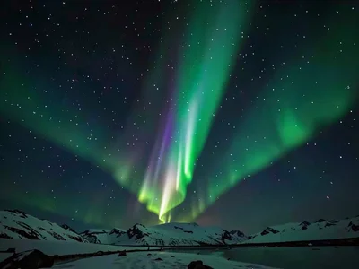 Aurora curtain showing vertical ray structure reaching upward