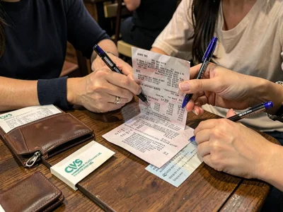 Arguing over restaurant receipt, splitting the bill, the financial negotiation, 