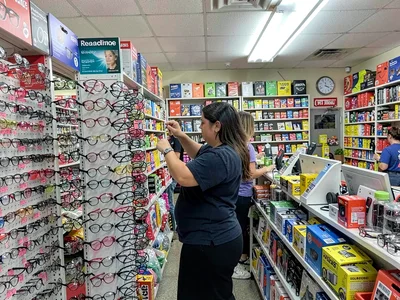 Reading glasses rack, trying on pairs, the practical abundance of discount optic