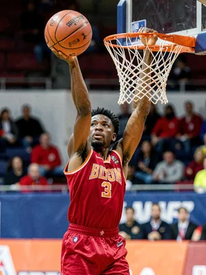 Basketball player shooting free throw, ball visible from release to net