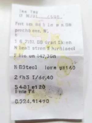 Thermal receipt from costume shop, itemized halloween purchases, fading