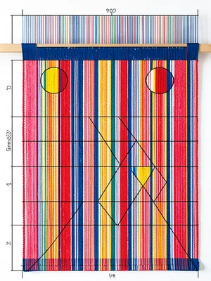 Woven textile on loom, warp threads forming strict vertical grid in three primar