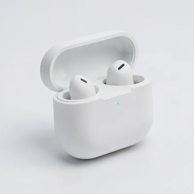 A wireless earbud case in matte white, open to show one bud inside, clean produc
