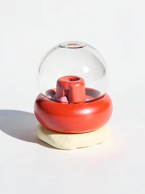 Rounded chunky clay gum-ball machine in cherry red with stubby cream-toned base