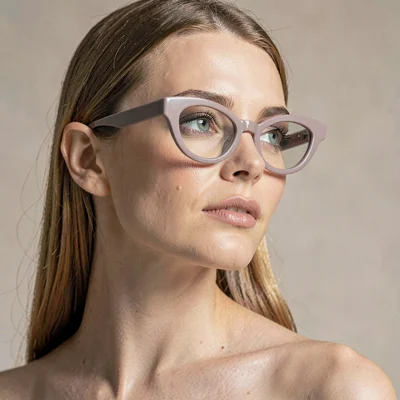 Sigrid-lampline portrait of a model in mauve cat-eye frames, head turned three-q