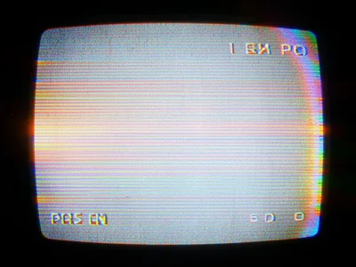 VHS pause of cartoon recording, flat colors and outlines distorted differently t