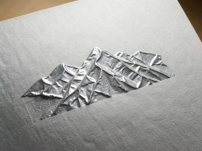 Foil with deliberate wrinkle pattern, controlled crumpling creating organic moun