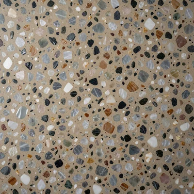 Classic Italian floor: small chips of mixed marble in warm grey cement, polished