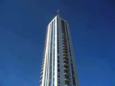 Cumulus tower against deep blue sky