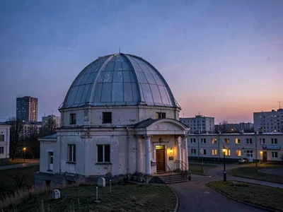 Soviet-era mounting and dome stark against modern sky