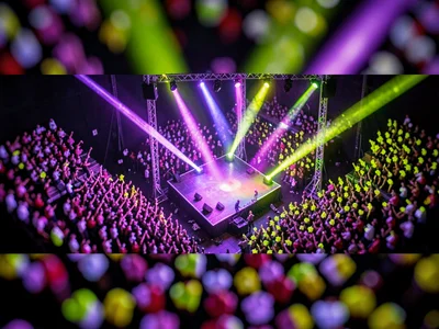 Concert tilt-shift photograph from a lighting truss, saturated violet and lime s