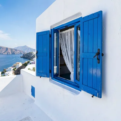 Sidi Bou Said cobalt-white, cliff-top absolute palette, Blue wooden window shutt