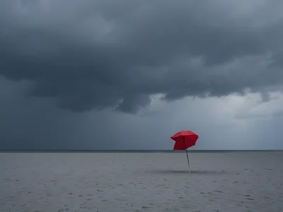 One red umbrella on a grey beach, storm clouds, minimalist isolation