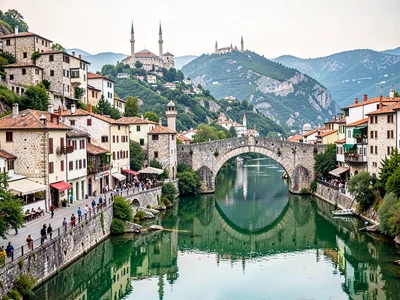 Old town hillside reflected in Neretva
