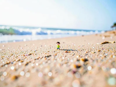 Figure tiny on beach