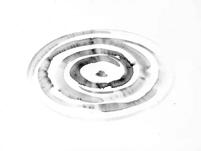 Water surface with one ripple expanding