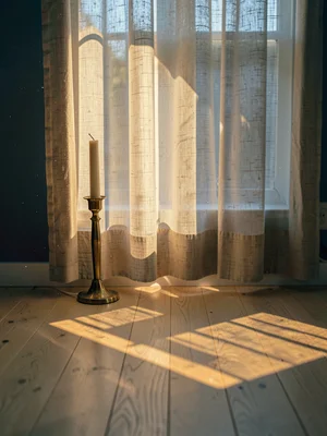 Brass candlestick with long morning shadow