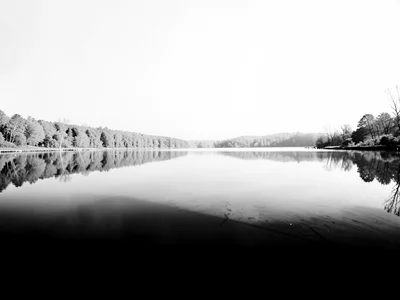 Lake reflection in infrared where the world above is white and the world below i
