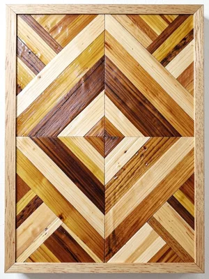 A straw marquetry panel with concentric diamond pattern in alternating light and