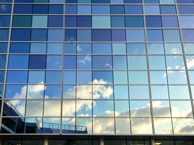 Glass panels showing sky at different times as pattern
